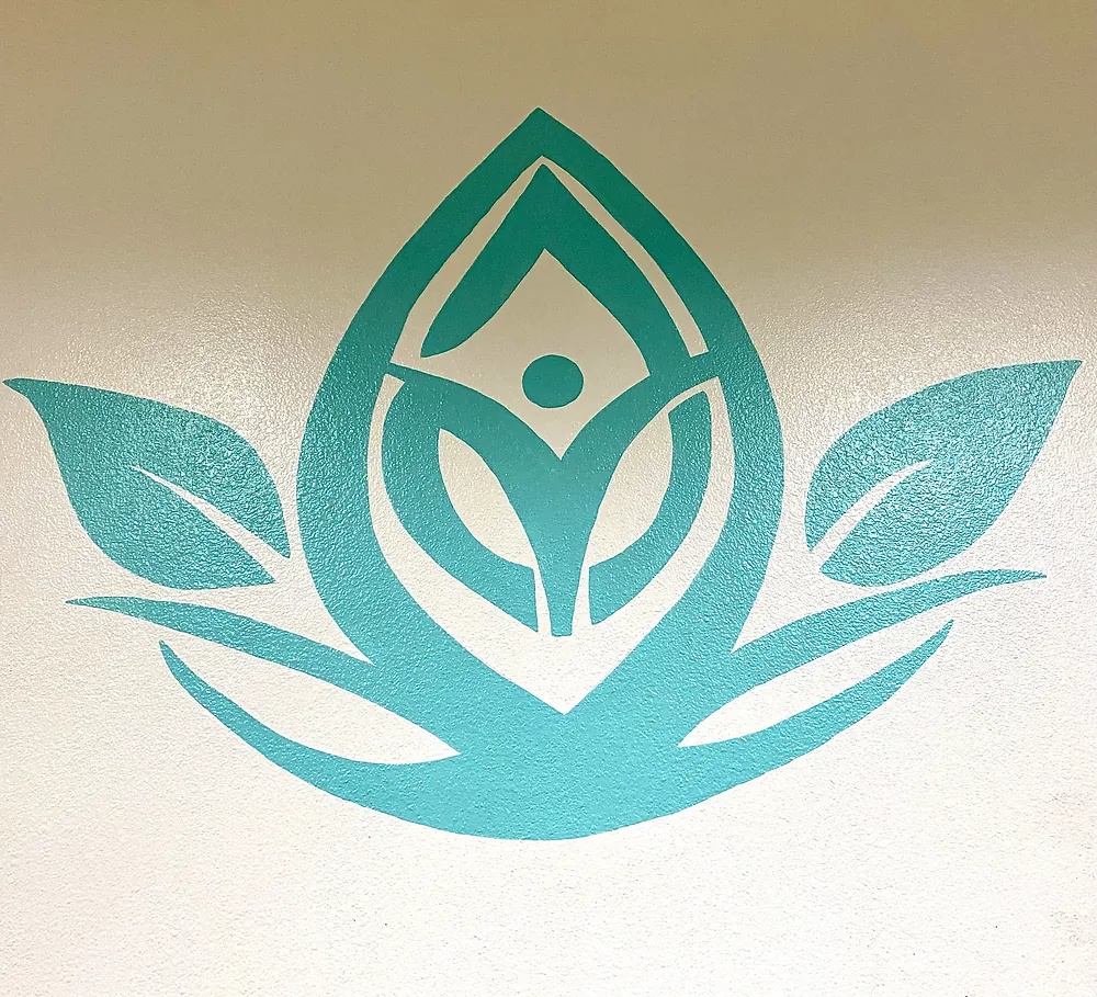 Serenity lotus logo painted on the studio wall